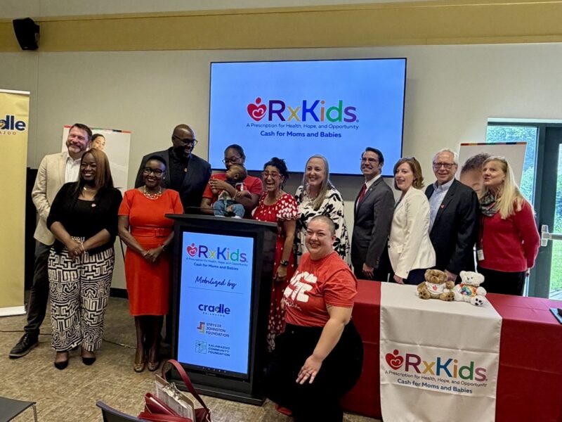 Group of adults and a baby posing at an Rx Kids event