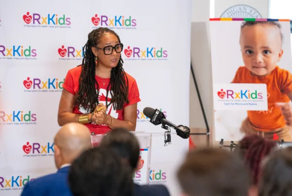 Mama Sol delivers her poem at Rx Kids expansion in Genesee County